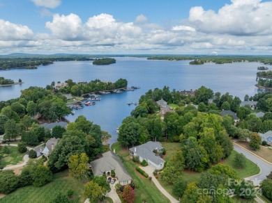 This Florida-style, hard stucco home is a beautiful ranch home on Trump National Golf Club Charlotte in North Carolina - for sale on GolfHomes.com, golf home, golf lot