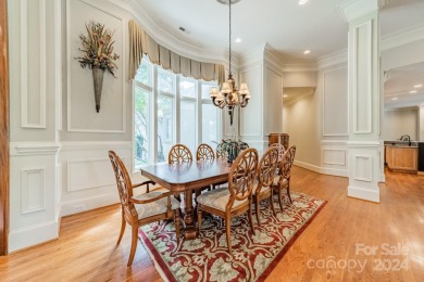 This Florida-style, hard stucco home is a beautiful ranch home on Trump National Golf Club Charlotte in North Carolina - for sale on GolfHomes.com, golf home, golf lot