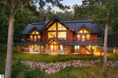 Welcome to this stunning Up North luxury log home perfectly on Boyne Mountain Resort - Monument Course in Michigan - for sale on GolfHomes.com, golf home, golf lot