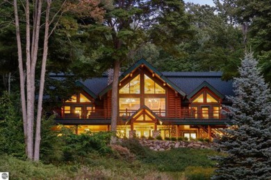 Welcome to this stunning Up North luxury log home perfectly on Boyne Mountain Resort - Monument Course in Michigan - for sale on GolfHomes.com, golf home, golf lot