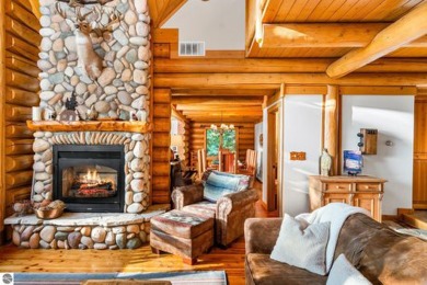 Welcome to this stunning Up North luxury log home perfectly on Boyne Mountain Resort - Monument Course in Michigan - for sale on GolfHomes.com, golf home, golf lot