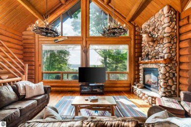 Welcome to this stunning Up North luxury log home perfectly on Boyne Mountain Resort - Monument Course in Michigan - for sale on GolfHomes.com, golf home, golf lot