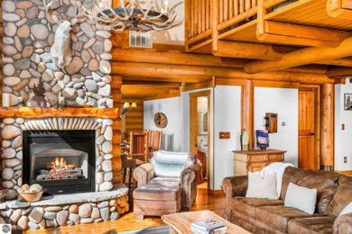 Welcome to this stunning Up North luxury log home perfectly on Boyne Mountain Resort - Monument Course in Michigan - for sale on GolfHomes.com, golf home, golf lot