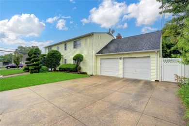Welcome to this timeless 5-bedroom, 2.5-bath colonial brimming on Middle Bay Country Club in New York - for sale on GolfHomes.com, golf home, golf lot