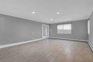 Welcome to this timeless 5-bedroom, 2.5-bath colonial brimming on Middle Bay Country Club in New York - for sale on GolfHomes.com, golf home, golf lot
