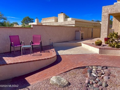 Nestled within the prestigious Omni Tucson National community on Omni Tucson National Golf Resort and Spa - Sonoran in Arizona - for sale on GolfHomes.com, golf home, golf lot