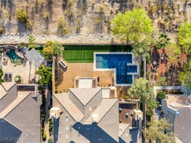 Cradled by the Red Rock Mountains, this exceptional estate on Red Rock Country Club in Nevada - for sale on GolfHomes.com, golf home, golf lot