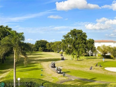 EXPANSIVE GOLF/WATER/CLUBHOUSE VIEW from this Favored LUXURY on Wynmoor Golf Course in Florida - for sale on GolfHomes.com, golf home, golf lot