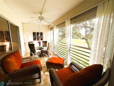 EXPANSIVE GOLF/WATER/CLUBHOUSE VIEW from this Favored LUXURY on Wynmoor Golf Course in Florida - for sale on GolfHomes.com, golf home, golf lot