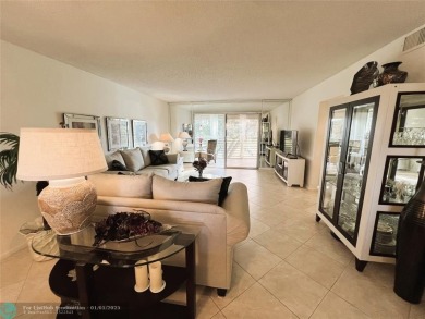 EXPANSIVE GOLF/WATER/CLUBHOUSE VIEW from this Favored LUXURY on Wynmoor Golf Course in Florida - for sale on GolfHomes.com, golf home, golf lot