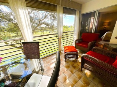 EXPANSIVE GOLF/WATER/CLUBHOUSE VIEW from this Favored LUXURY on Wynmoor Golf Course in Florida - for sale on GolfHomes.com, golf home, golf lot