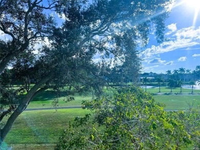 EXPANSIVE GOLF/WATER/CLUBHOUSE VIEW from this Favored LUXURY on Wynmoor Golf Course in Florida - for sale on GolfHomes.com, golf home, golf lot