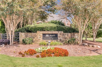 This three-sided brick traditional beauty delivers space, style on Polo Golf and Country Club in Georgia - for sale on GolfHomes.com, golf home, golf lot