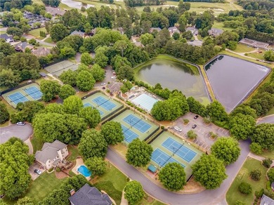 This three-sided brick traditional beauty delivers space, style on Polo Golf and Country Club in Georgia - for sale on GolfHomes.com, golf home, golf lot
