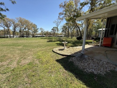 Located in Rolling Greens Village, a 55+ community in Ocala on Rolling Greens Executive Golf Community in Florida - for sale on GolfHomes.com, golf home, golf lot