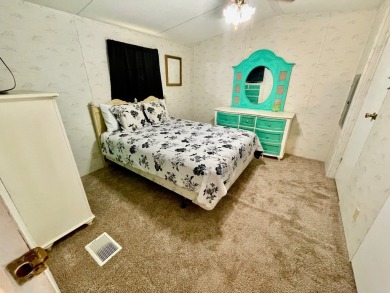 Welcome home to this 1994 single wide manufactured home, which on Golden Lakes Golf Course in Florida - for sale on GolfHomes.com, golf home, golf lot