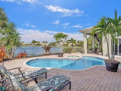 Stunning 5 Bedroom 4 Bath Waterfront Pool Home Located In Olde on Heron Bay Golf Club in Florida - for sale on GolfHomes.com, golf home, golf lot