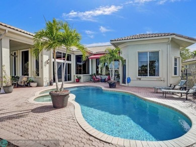 Stunning 5 Bedroom 4 Bath Waterfront Pool Home Located In Olde on Heron Bay Golf Club in Florida - for sale on GolfHomes.com, golf home, golf lot