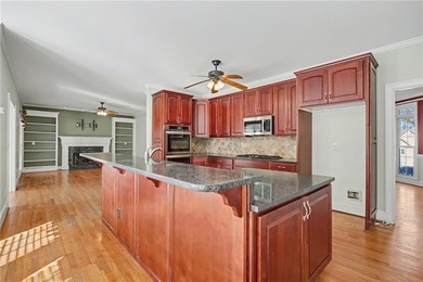 Tucked away on a quiet, double cul-de-sac street is the stately on Brookstone Golf and Country Club in Georgia - for sale on GolfHomes.com, golf home, golf lot