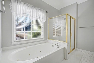 Tucked away on a quiet, double cul-de-sac street is the stately on Brookstone Golf and Country Club in Georgia - for sale on GolfHomes.com, golf home, golf lot