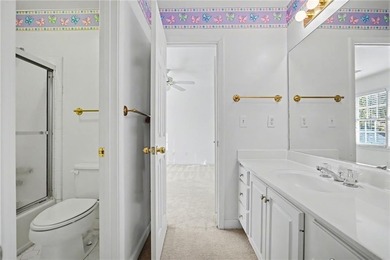 Tucked away on a quiet, double cul-de-sac street is the stately on Brookstone Golf and Country Club in Georgia - for sale on GolfHomes.com, golf home, golf lot