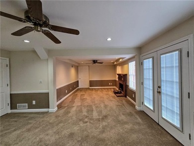 Tucked away on a quiet, double cul-de-sac street is the stately on Brookstone Golf and Country Club in Georgia - for sale on GolfHomes.com, golf home, golf lot