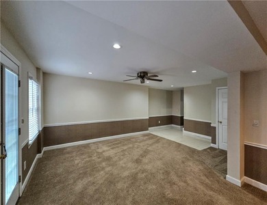 Tucked away on a quiet, double cul-de-sac street is the stately on Brookstone Golf and Country Club in Georgia - for sale on GolfHomes.com, golf home, golf lot