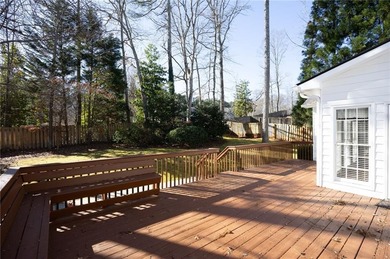 Tucked away on a quiet, double cul-de-sac street is the stately on Brookstone Golf and Country Club in Georgia - for sale on GolfHomes.com, golf home, golf lot