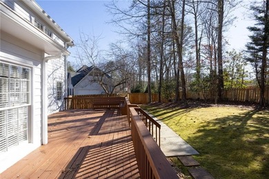 Tucked away on a quiet, double cul-de-sac street is the stately on Brookstone Golf and Country Club in Georgia - for sale on GolfHomes.com, golf home, golf lot