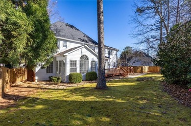 Tucked away on a quiet, double cul-de-sac street is the stately on Brookstone Golf and Country Club in Georgia - for sale on GolfHomes.com, golf home, golf lot