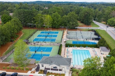 Tucked away on a quiet, double cul-de-sac street is the stately on Brookstone Golf and Country Club in Georgia - for sale on GolfHomes.com, golf home, golf lot