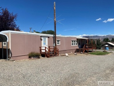Charming, well-kept home on a nicely landscaped lot in Challis on Challis Golf Course in Idaho - for sale on GolfHomes.com, golf home, golf lot