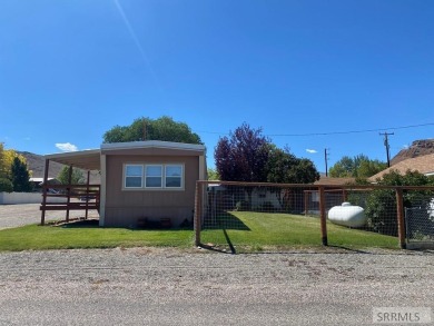 Charming, well-kept home on a nicely landscaped lot in Challis on Challis Golf Course in Idaho - for sale on GolfHomes.com, golf home, golf lot
