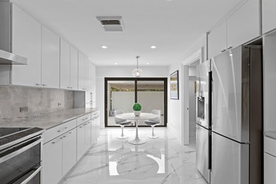 Welcome to this exquisitely re-designed and renovated from on The President Country Club in Florida - for sale on GolfHomes.com, golf home, golf lot