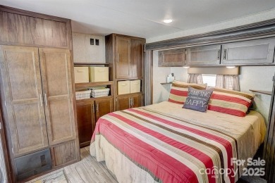 Welcome to your perfect getaway in Twin Harbor on Lake Tillery on The Tillery Tradition Country Club in North Carolina - for sale on GolfHomes.com, golf home, golf lot