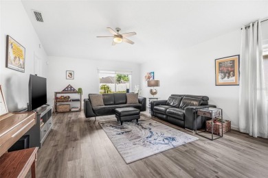 Welcome to this beautifully updated 3-bedroom, 2-bathroom home on Heritage Isles Golf and Country Club in Florida - for sale on GolfHomes.com, golf home, golf lot