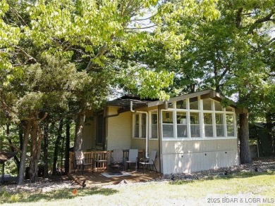Check out this gem.  The iconic Tan Tar A Estates neighbors on The Oaks Golf Course in Missouri - for sale on GolfHomes.com, golf home, golf lot