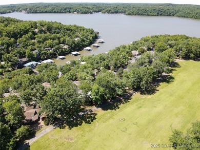 Check out this gem.  The iconic Tan Tar A Estates neighbors on The Oaks Golf Course in Missouri - for sale on GolfHomes.com, golf home, golf lot