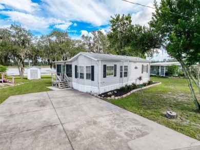 NO LOT RENT, it is a deeded lot, 2 bedrooms 1 Bath. A/C 2018 and on Glen Lakes Country Club in Florida - for sale on GolfHomes.com, golf home, golf lot