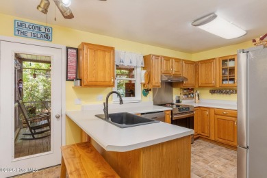 Welcome to this beautifully maintained 4-bedroom, 2-bath coastal on The Country Club of the Crystal Coast in North Carolina - for sale on GolfHomes.com, golf home, golf lot