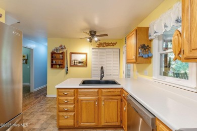 Welcome to this beautifully maintained 4-bedroom, 2-bath coastal on The Country Club of the Crystal Coast in North Carolina - for sale on GolfHomes.com, golf home, golf lot