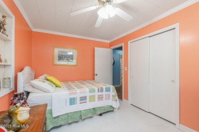 Welcome to this beautifully maintained 4-bedroom, 2-bath coastal on The Country Club of the Crystal Coast in North Carolina - for sale on GolfHomes.com, golf home, golf lot