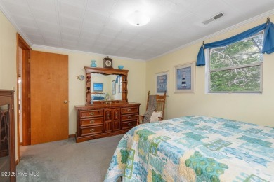 Welcome to this beautifully maintained 4-bedroom, 2-bath coastal on The Country Club of the Crystal Coast in North Carolina - for sale on GolfHomes.com, golf home, golf lot