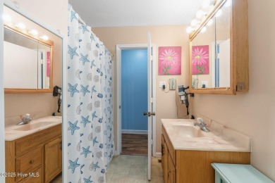 Welcome to this beautifully maintained 4-bedroom, 2-bath coastal on The Country Club of the Crystal Coast in North Carolina - for sale on GolfHomes.com, golf home, golf lot