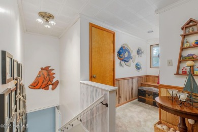 Welcome to this beautifully maintained 4-bedroom, 2-bath coastal on The Country Club of the Crystal Coast in North Carolina - for sale on GolfHomes.com, golf home, golf lot