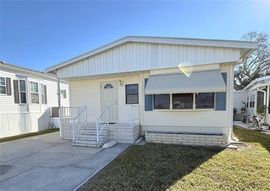 TWO BEDROOM, TWO BATHROOM MOBILE HOME IN ACTIVE 55+ COMMUNITY on River Run Golf Links in Florida - for sale on GolfHomes.com, golf home, golf lot