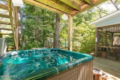 Welcome to this beautifully maintained 4-bedroom, 2-bath coastal on The Country Club of the Crystal Coast in North Carolina - for sale on GolfHomes.com, golf home, golf lot