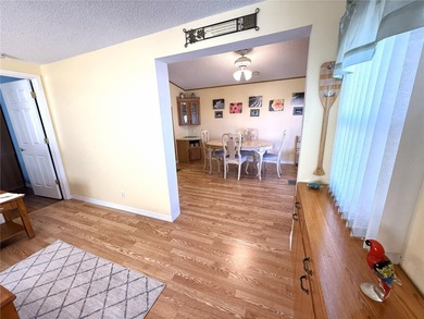 TWO BEDROOM, TWO BATHROOM MOBILE HOME IN ACTIVE 55+ COMMUNITY on River Run Golf Links in Florida - for sale on GolfHomes.com, golf home, golf lot