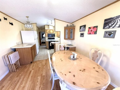 TWO BEDROOM, TWO BATHROOM MOBILE HOME IN ACTIVE 55+ COMMUNITY on River Run Golf Links in Florida - for sale on GolfHomes.com, golf home, golf lot