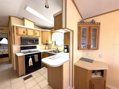 TWO BEDROOM, TWO BATHROOM MOBILE HOME IN ACTIVE 55+ COMMUNITY on River Run Golf Links in Florida - for sale on GolfHomes.com, golf home, golf lot